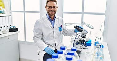 a smiling dental lab technician