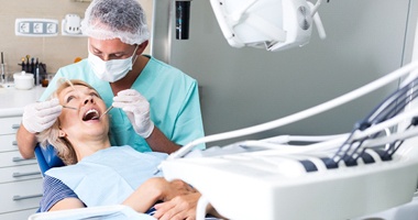 dentist examining patient’s teeth