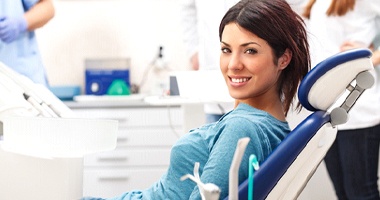 Smiling woman in the dental chair 