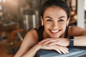 woman smiles at gym
